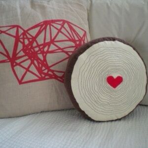 Round wood grain pillow with heart center - Woodland Nursery theme